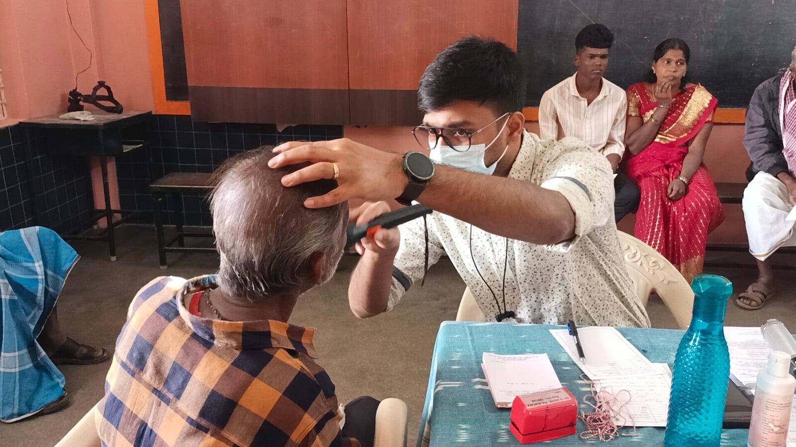 Free eye screening during 28th Cataract Surgery Eye Camp and Doctors examining patients at Free Cataract Surgery Camp