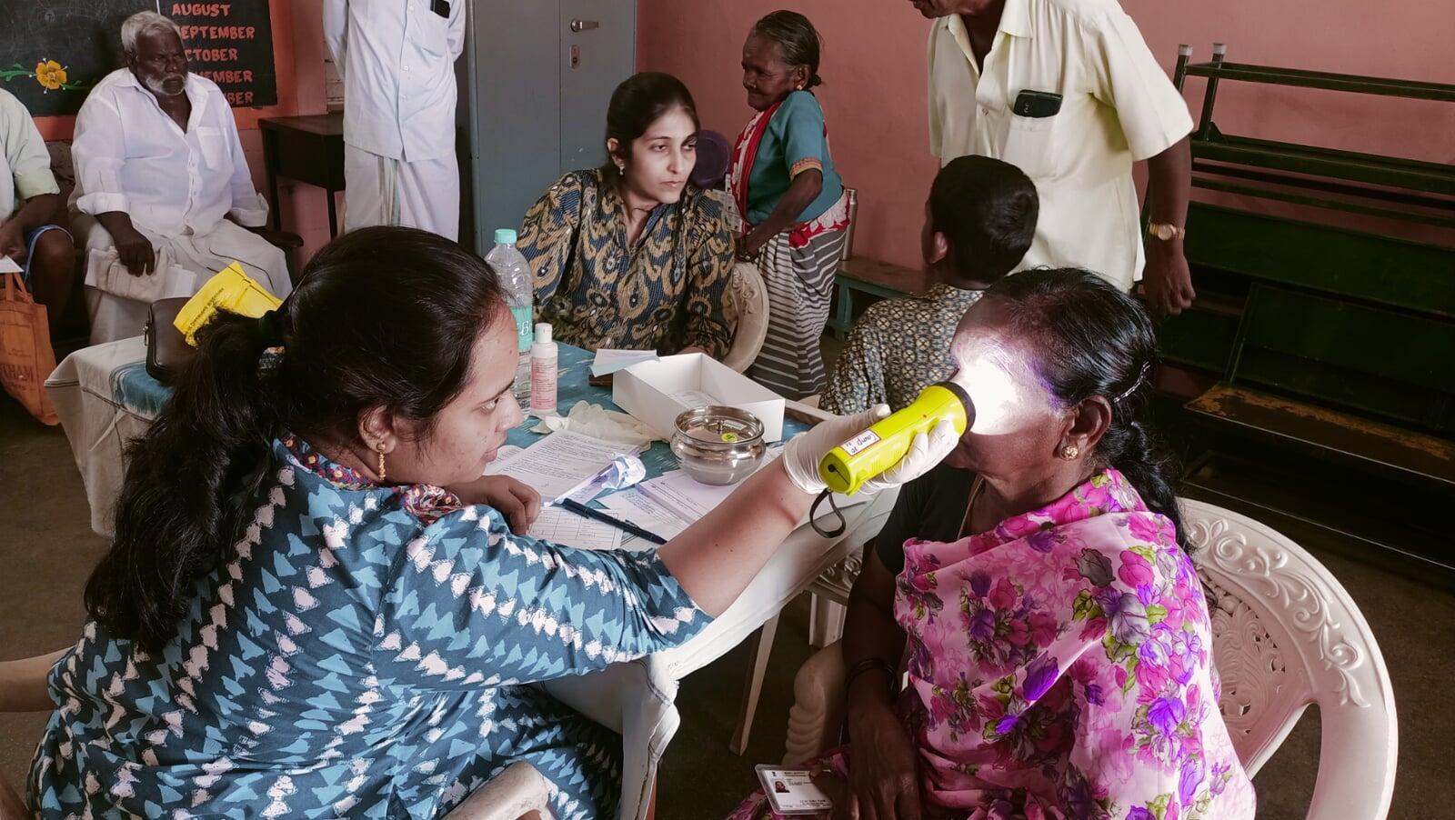 Free eye screening during 29th Cataract Surgery Eye Camp and Doctors examining patients at Free Cataract Surgery Camp