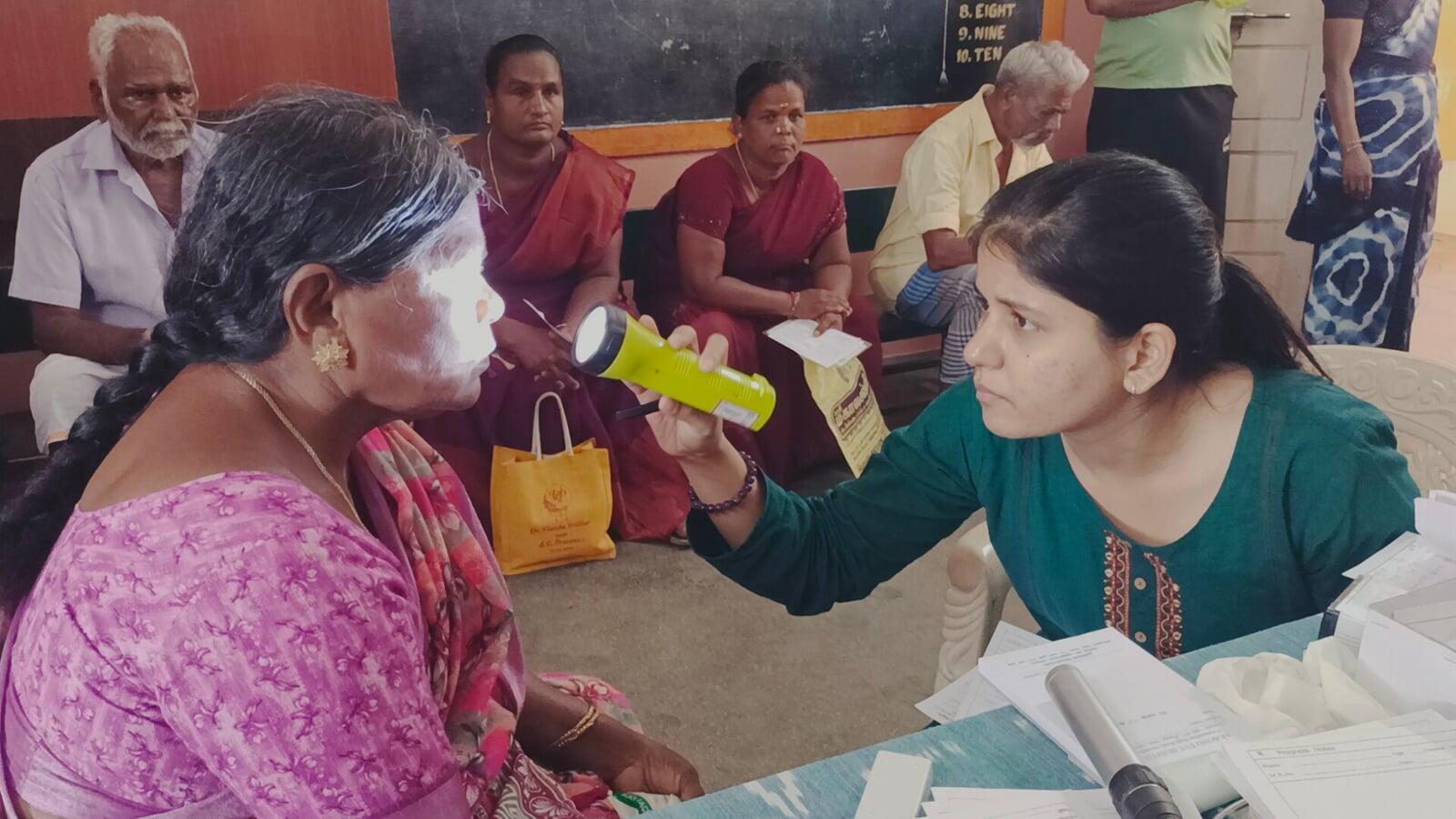 Free eye screening during 31th Cataract Surgery Eye Camp and Doctors examining patients at Free Cataract Surgery Camp
